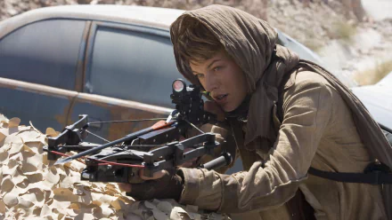 Alice from Resident Evil: Extinction, portrayed by Milla Jovovich, prepares for action with a crossbow, set against a rugged, desert backdrop. HD desktop wallpaper captures the intensity.