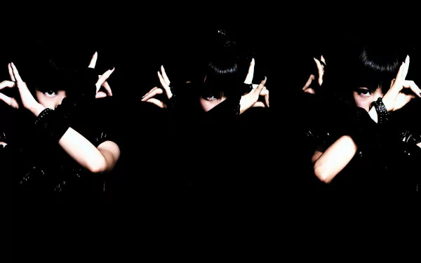 HD desktop wallpaper featuring a Japanese Babymetal idol in heavy metal style, set against a dark background with dynamic poses and intense expressions.