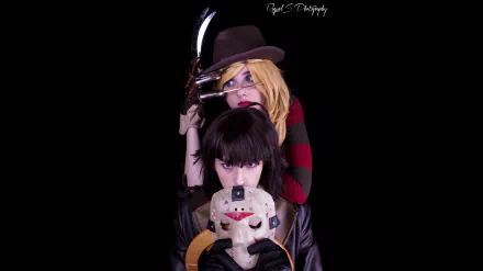 8K Ultra HD PC desktop wallpaper of two women in cosplay: one in a fedora with a bladed glove behind another holding a cracked hockey mask, set against a deep black background.