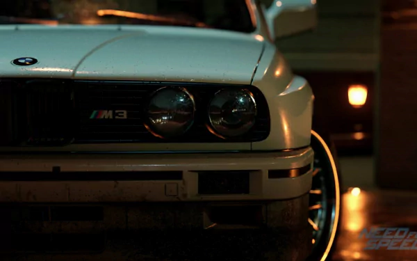 HD desktop wallpaper featuring a detailed close-up of a classic BMW M3 from the video game Need For Speed (2015), showcasing the car's headlights and front grille in a dimly lit setting.