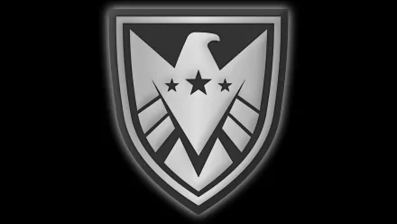A sleek black and silver logo featuring an eagle on a shield, inspired by S.H.I.E.L.D., serves as a striking HD desktop wallpaper and background for comic enthusiasts.