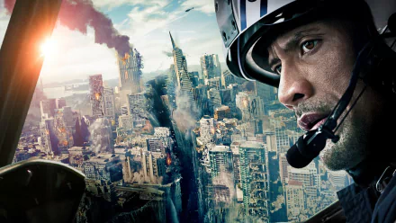 HD PC desktop wallpaper featuring Dwayne Johnson from the movie San Andreas, depicting a dramatic cityscape earthquake scene.