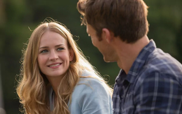 HD PC desktop wallpaper from the movie The Longest Ride featuring a close-up of a smiling woman and a man engaged in conversation outdoors.