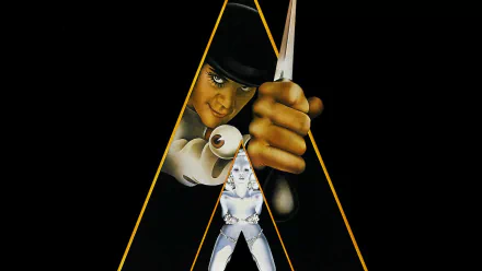A Clockwork Orange movie HD PC desktop wallpaper: bowler-hatted figure peers through a golden triangular frame, holding a knife above a stylized dancer against a black background.