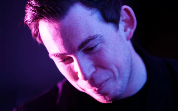 Close-up portrait of Hardwell bathed in soft purple light, captured as a 4K Ultra HD music-themed PC desktop wallpaper and background.