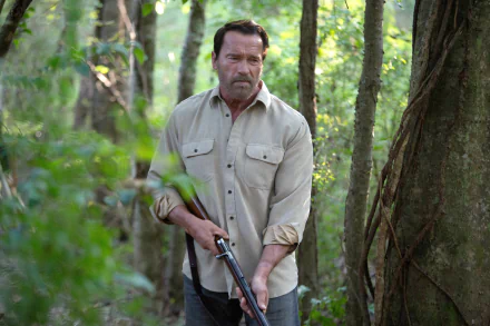 HD desktop wallpaper from the movie Maggie (2015) showing a man in a light shirt holding a shotgun in a dense forest setting.