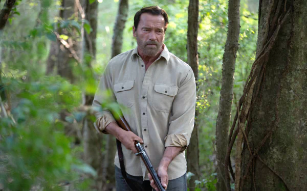 HD desktop wallpaper from the movie Maggie (2015) showing a man in a light shirt holding a shotgun in a dense forest setting.