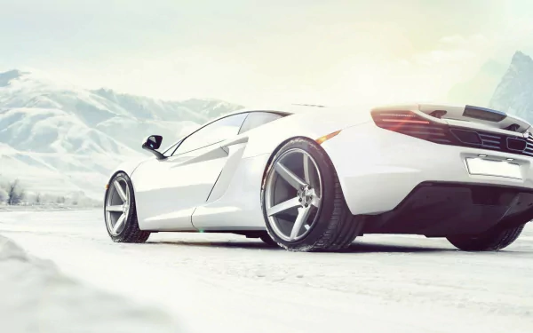 White McLaren MP4-12C vehicle at a low rear angle on a snowy landscape — HD PC desktop wallpaper and background.