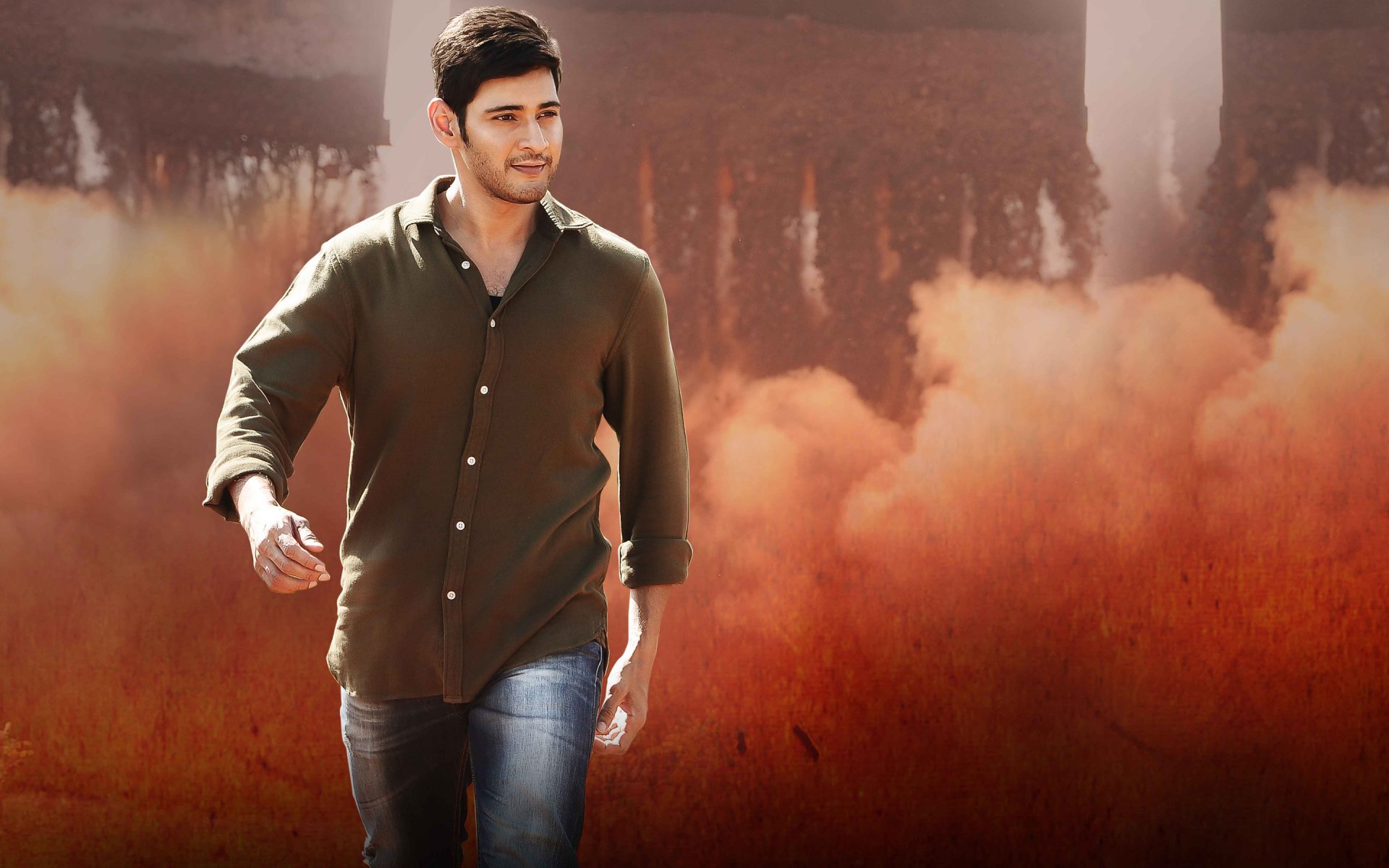 HD PC desktop wallpaper featuring Mahesh Babu from the movie Srimanthudu, showcasing him walking confidently against a smoky, dramatic background.