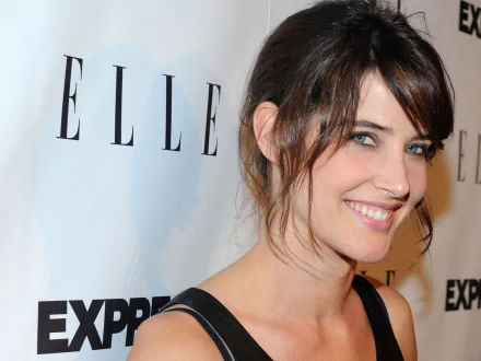 HD PC desktop wallpaper featuring a smiling Cobie Smulders, captured at an event with a branded backdrop.