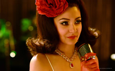 Glamorous vintage movie-style portrait of an actress with a red rose in her hair, jeweled necklace and red glove, holding a retro microphone — 2K Quad HD desktop wallpaper