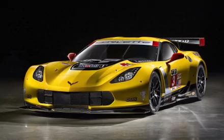 HD desktop wallpaper featuring a vibrant yellow 2014 Chevrolet Corvette C7R race car, showcasing Chevrolet’s sleek and powerful vehicle design.
