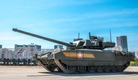 HD desktop wallpaper featuring a T-14 Armata military tank positioned in an urban environment under a clear blue sky.