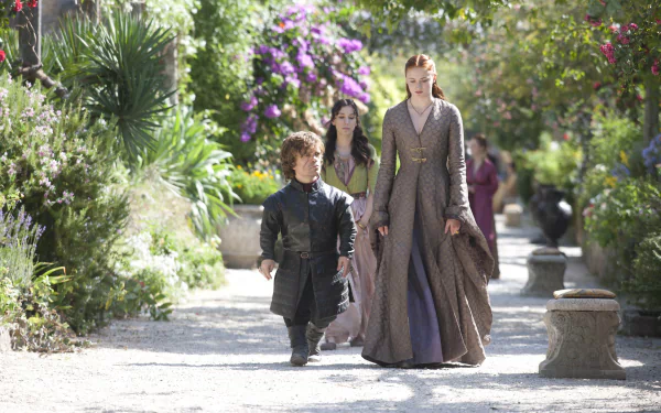 Tyrion Lannister and Sansa Stark, portrayed by Peter Dinklage and Sophie Turner, walk through a lush garden in this 4K Ultra HD Game of Thrones desktop wallpaper.