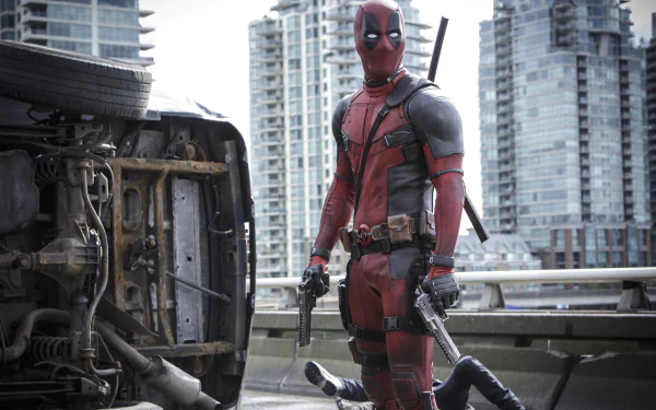 Deadpool stands confidently in a cityscape, guns drawn, next to an overturned vehicle. This HD desktop wallpaper captures the bold essence of the iconic movie character.