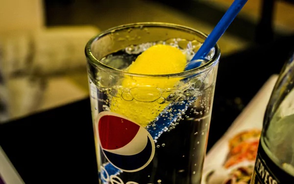A glass of Pepsi with ice and a blue straw, tagged as man-made, captured in HD as a desktop wallpaper background.