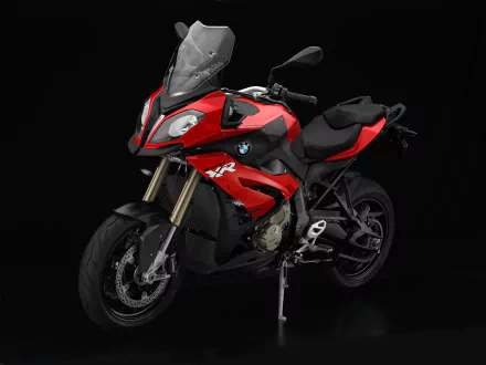 Red BMW S1000 XR motorcycle showcased on a black background, serving as a high-definition PC desktop wallpaper featuring the sleek BMW vehicle design.