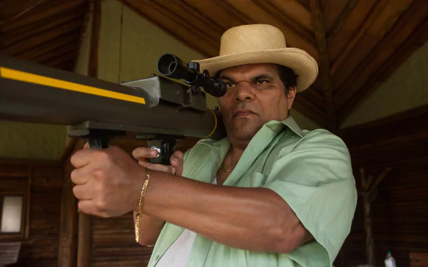 HD desktop wallpaper and background featuring a man in a straw hat aiming a rifle from the series Narcos.