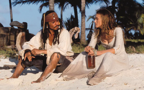 Jack Sparrow and Elizabeth Swann share a moment on a beach in a scene from Pirates of the Caribbean: The Curse of the Black Pearl, featuring Keira Knightley and Johnny Depp.