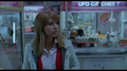 HD PC desktop wallpaper featuring Scarlett Johansson from the movie Lost In Translation, capturing a contemplative moment in a softly lit urban setting.