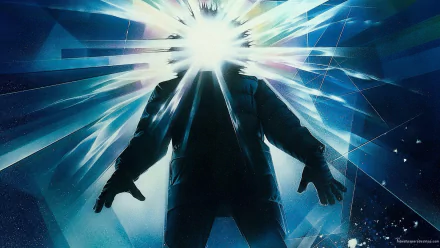 HD PC desktop wallpaper of the 1982 movie The Thing, featuring a silhouetted figure with a bright, shattered light effect emanating from the head.