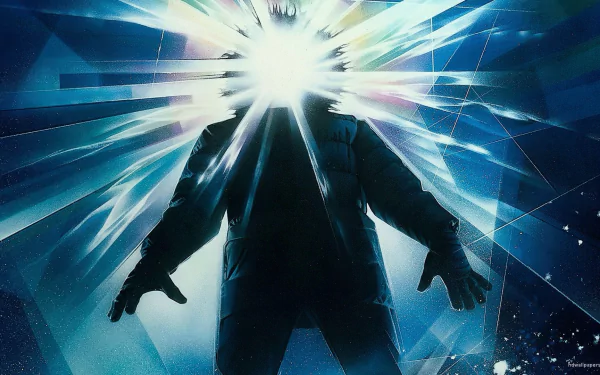 HD PC desktop wallpaper of the 1982 movie The Thing, featuring a silhouetted figure with a bright, shattered light effect emanating from the head.