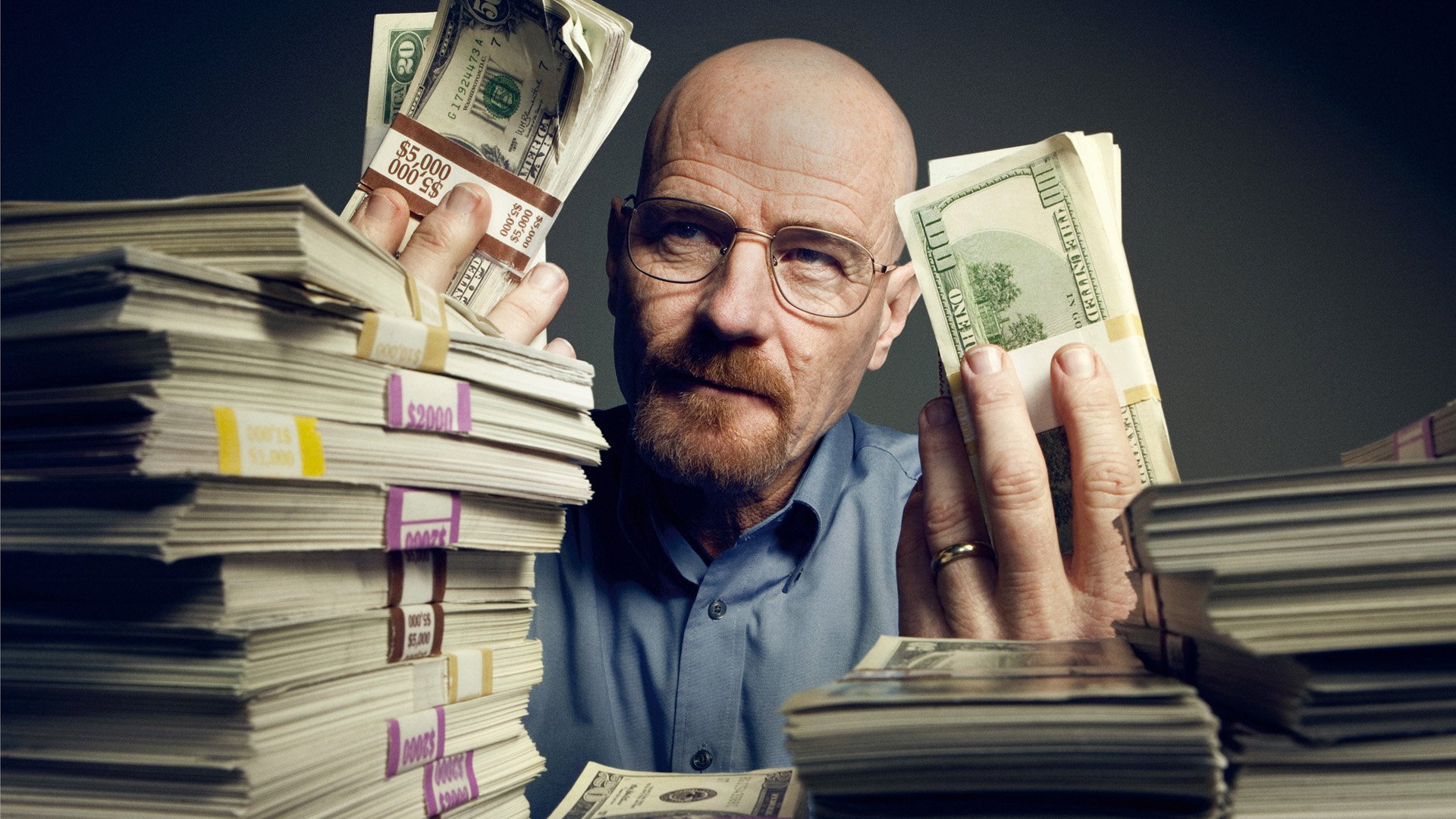 HD desktop wallpaper: bald, bespectacled man counting piles of cash amid bundled stacks, moody TV crime-drama aesthetic.