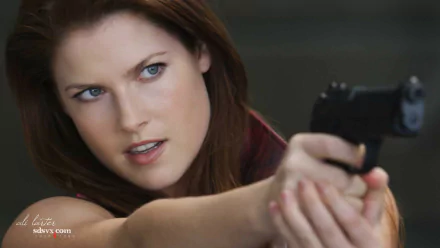 HD desktop wallpaper featuring Ali Larter as Claire Redfield in the movie Resident Evil: Afterlife, aiming a handgun with intense focus.