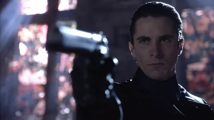 HD desktop wallpaper featuring Christian Bale in a tense scene from the movie Equilibrium, holding a gun and staring intensely.