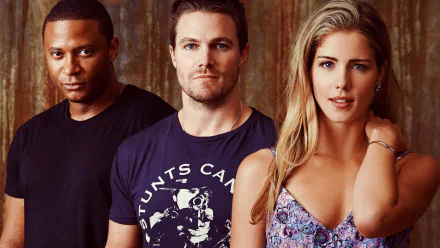 HD wallpaper featuring characters from the TV show Arrow, including David Ramsey, Stephen Amell, and Emily Bett Rickards, posed against a textured background.
