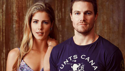 HD desktop wallpaper featuring Emily Bett Rickards and Stephen Amell from the TV show Arrow, showcasing their strong chemistry in a vibrant portrait.