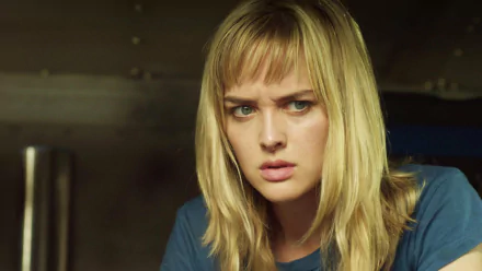 A close-up of Jess Weixler from the movie Free Samples, featuring her intense expression. This high-definition image serves as an engaging background for PC desktops.