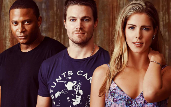 HD wallpaper featuring characters from the TV show Arrow, including David Ramsey, Stephen Amell, and Emily Bett Rickards, posed against a textured background.