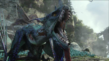 HD PC desktop wallpaper from the movie Avatar, featuring a fierce, open-mouthed creature in a lush, mountainous environment.