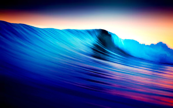 A vibrant, high-resolution 4K Ultra HD wallpaper featuring a dynamic ocean wave at sunset, showcasing rich blues and warm hues for a stunning nature background.