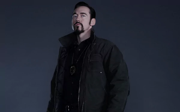 HD PC desktop wallpaper: brooding character from TV show The Strain in a dark coat standing against a gray background.