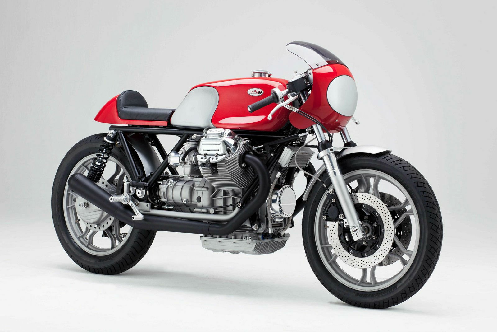 Red Moto Guzzi cafe‑racer motorcycle on a clean white backdrop, a vehicle image presented as an HD PC desktop wallpaper and background.
