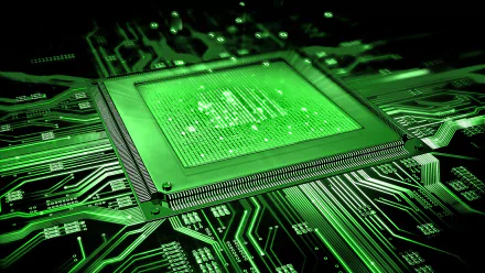 A close-up of a green circuit board featuring a central processing unit, showcasing intricate technology designs. This vibrant 4K Ultra HD wallpaper adds a tech-inspired touch to any background.