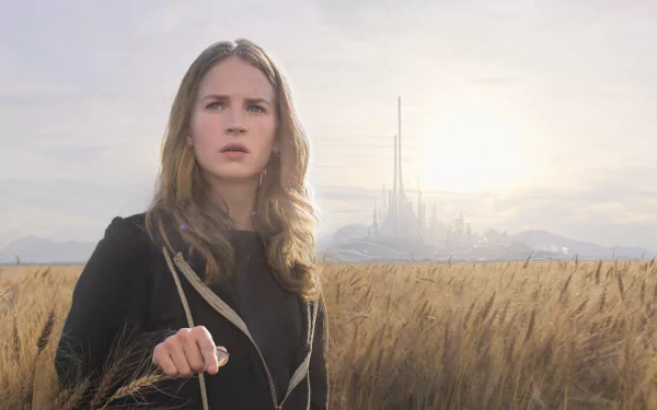 Brittany Robertson in a scene from the movie Tomorrowland, standing in a field with a futuristic city skyline in the background, presented in 4K Ultra HD.