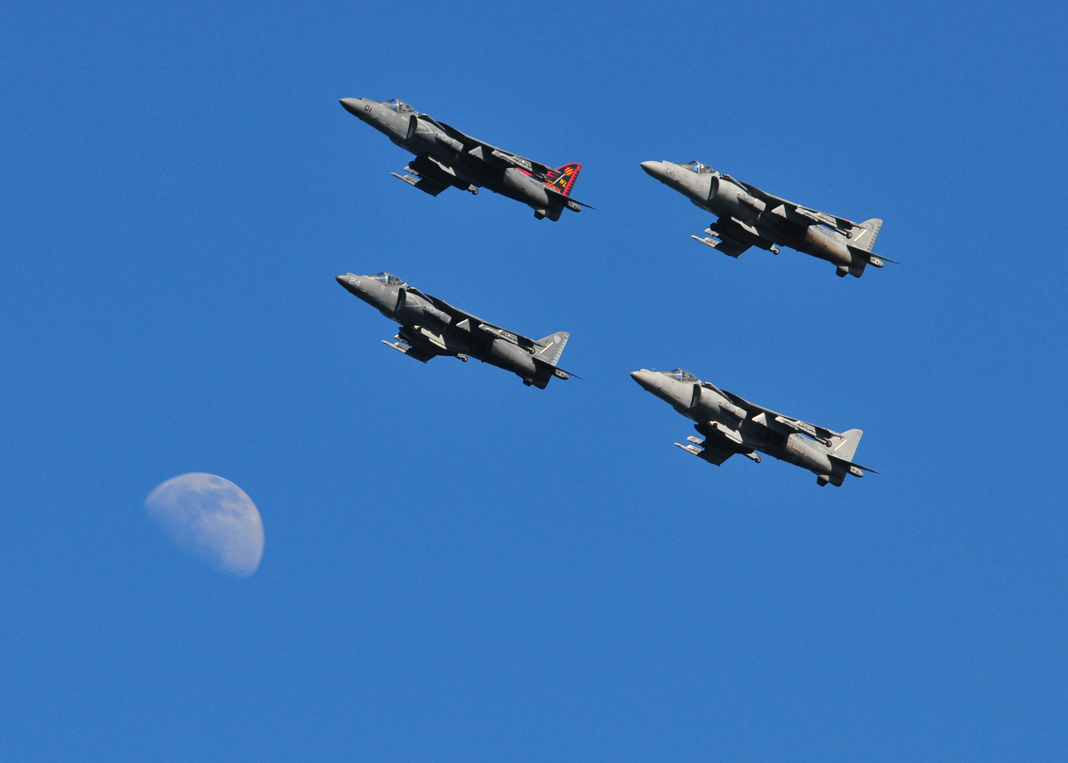 AV-8B Harriers fly by the moon over San Diego Bay by Trevor Welsh