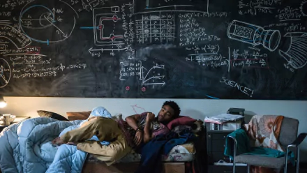HD PC desktop wallpaper from the movie The Martian, featuring a character resting on a bed beneath a chalkboard filled with scientific formulas and diagrams.