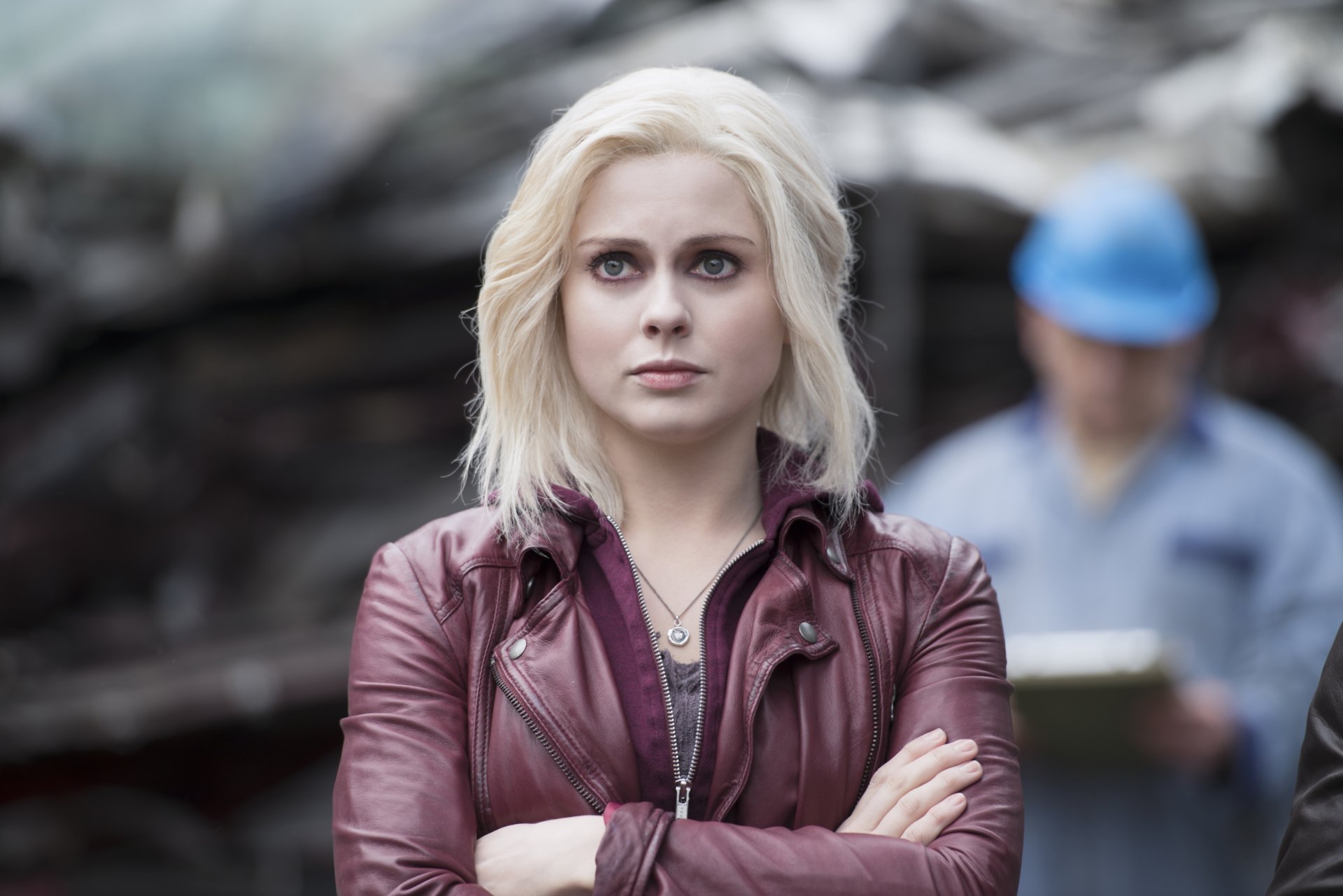 HD desktop wallpaper featuring Rose McIver as Liv Moore from the TV show iZombie, with a focused expression and casual outfit against a blurred outdoor background.