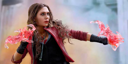 A detailed figurine of Scarlet Witch, portrayed by Elizabeth Olsen in Avengers: Age of Ultron, showcasing her dynamic powers with vibrant effects, set against a captivating background.