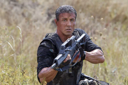 Sylvester Stallone as Barney Ross in a dynamic scene from *The Expendables 3*, depicted in vivid detail for a striking 4K Ultra HD desktop wallpaper.