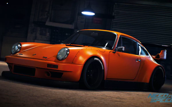 An HD desktop wallpaper featuring an orange sports car against a dimly lit garage backdrop, inspired by the video game Need for Speed (2015).