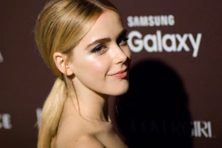 HD PC desktop wallpaper featuring celebrity Kiernan Shipka with a sleek hairstyle, posing confidently against a dark backdrop with Samsung Galaxy branding.