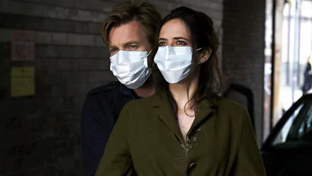 Ewan McGregor and Eva Green wearing masks in a scene from the movie Perfect Sense, featured as an HD PC desktop wallpaper and background.