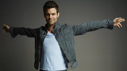 A high-resolution 4K Ultra HD PC desktop wallpaper featuring a confident man from the TV show The Originals with arms outstretched against a neutral background.