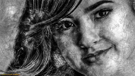 A striking black-and-white HD wallpaper featuring American singer Becky G, capturing her captivating expression and artistry in music.