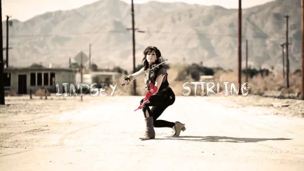 HD PC desktop wallpaper featuring musician Lindsey Stirling playing violin in a desert landscape with mountains in the background.